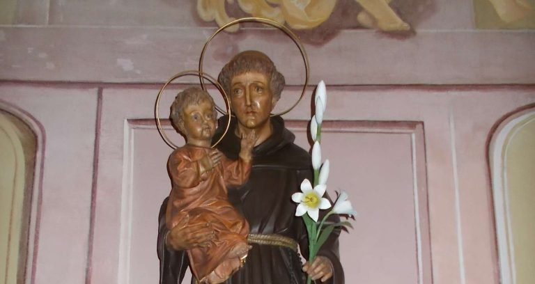Why is Saint Anthony depicted holding the Child Jesus?