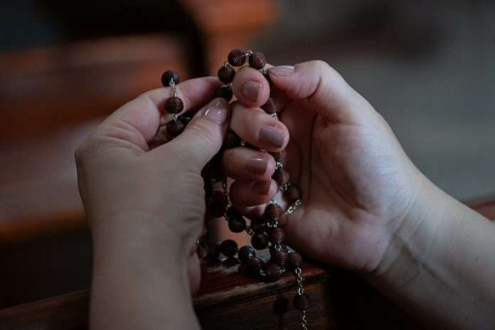 When is it superstitious or wrong to carry a Rosary?